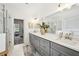 Bathroom features a double sink vanity and large mirror at 3991 Perry Pass, Lithonia, GA 30038