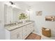 Bright bathroom featuring double sinks, white marble, granite countertops, and a large mirror at 3991 Perry Pass, Lithonia, GA 30038