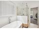 Bright bathroom featuring a soaking tub, glass-enclosed shower, and natural light from the window at 3991 Perry Pass, Lithonia, GA 30038