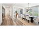 Bright dining room featuring modern lighting, an open design, hardwood floors and modern dining table at 3991 Perry Pass, Lithonia, GA 30038