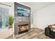 Cozy living room fireplace with a modern tiled surround and natural light at 3991 Perry Pass, Lithonia, GA 30038