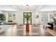 Bright foyer with a clear view of the dining room, wood floors, and modern decor at 3991 Perry Pass, Lithonia, GA 30038
