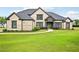 Beautiful brick home with a manicured lawn and mature landscaping at 3991 Perry Pass, Lithonia, GA 30038