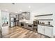 Spacious kitchen featuring stainless steel appliances, wine storage, and an open layout to the dining area at 3991 Perry Pass, Lithonia, GA 30038