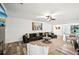 Spacious living room with a fireplace, wood floors, and comfortable seating arrangements at 3991 Perry Pass, Lithonia, GA 30038