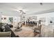 Open concept living room with views of kitchen, modern decor and inviting seating at 3991 Perry Pass, Lithonia, GA 30038