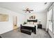 Spacious main bedroom with a ceiling fan, plush carpeting, and a king-size bed at 3991 Perry Pass, Lithonia, GA 30038