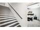 Staircase leading to main bedroom with black and white finish, plus carpeted steps at 3991 Perry Pass, Lithonia, GA 30038