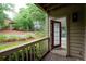 Balcony view showcases outdoor living space with a glimpse inside through an open door at 705 Country Park Se Dr, Smyrna, GA 30080