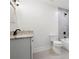 Bathroom featuring a granite countertop vanity, new toilet and a tiled tub and shower at 705 Country Park Se Dr, Smyrna, GA 30080