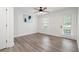 This bedroom features wood flooring, a modern ceiling fan and a glass door to the outside at 705 Country Park Se Dr, Smyrna, GA 30080