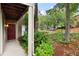 Inviting condo entrance with a red door and views of the surrounding trees at 705 Country Park Se Dr, Smyrna, GA 30080