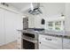 Well-equipped kitchen with stainless steel oven, smooth cooktop, and ample storage in white cabinets at 705 Country Park Se Dr, Smyrna, GA 30080