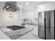 Modern kitchen featuring granite countertops, stainless steel appliances, and white cabinetry at 705 Country Park Se Dr, Smyrna, GA 30080