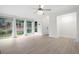 Inviting living room features large windows, light floors, and a stylish ceiling fan at 705 Country Park Se Dr, Smyrna, GA 30080