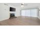 Spacious living room featuring a fireplace, TV, and abundant natural light from large sliding doors at 705 Country Park Se Dr, Smyrna, GA 30080