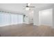 Bright living room with light floors, sheer curtains and modern ceiling fan at 705 Country Park Se Dr, Smyrna, GA 30080