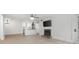 Open-concept living area with updated kitchen, fireplace, and light floors, ideal for modern living at 705 Country Park Se Dr, Smyrna, GA 30080