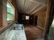 Kitchen featuring a sink, window, and unfinished walls with wood flooring at 2135 Wells Se Dr, Smyrna, GA 30080