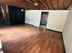 Unfinished living room with exposed ceiling beams, hardwood floors, and freshly painted walls at 2135 Wells Se Dr, Smyrna, GA 30080