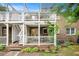 Brick home showcasing a multilevel deck perfect for outdoor relaxation with lush landscaping at 2349 Henderson Mill Ne Rd # 2, Atlanta, GA 30345