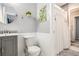 Tastefully decorated bathroom with gray vanity, updated fixtures, and shower-tub combo at 2349 Henderson Mill Ne Rd # 2, Atlanta, GA 30345