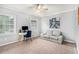 Bright room with lots of natural light featuring a desk, sofa, ceiling fan and neutral carpet at 2349 Henderson Mill Ne Rd # 2, Atlanta, GA 30345