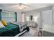 Stylish bedroom with a ceiling fan, lots of natural light and modern furniture at 2349 Henderson Mill Ne Rd # 2, Atlanta, GA 30345