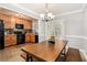 Cozy dining area with stylish table and bench seating, flowing into the adjacent kitchen at 2349 Henderson Mill Ne Rd # 2, Atlanta, GA 30345