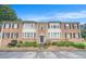 Charming brick townhouse with black shutters, trimmed windows and well-kept landscaping at 2349 Henderson Mill Ne Rd # 2, Atlanta, GA 30345
