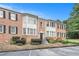 Charming brick townhouse with black shutters, trimmed windows and well-kept landscaping at 2349 Henderson Mill Ne Rd # 2, Atlanta, GA 30345