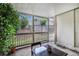 Cozy covered patio featuring a glass-top table and chairs, perfect for relaxing outdoors at 2349 Henderson Mill Ne Rd # 2, Atlanta, GA 30345