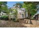 A view of the backyard which features a patio space, privacy fence and a serene setting to enjoy at 2735 Royal Blf, Decatur, GA 30030