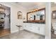 Elegant bathroom vanity featuring dual sinks, a stool, and modern fixtures at 2735 Royal Blf, Decatur, GA 30030