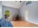 Office space features a high ceiling, large window, and comfortable furnishings at 2735 Royal Blf, Decatur, GA 30030
