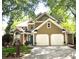 Two-story home with a two-car garage, a manicured lawn and a beautiful teal front door at 2735 Royal Blf, Decatur, GA 30030