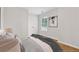 Bedroom featuring wood flooring, neutral walls, and a picture window at 3055 Kennesaw Nw Dr, Kennesaw, GA 30152