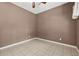 Cozy bedroom featuring neutral paint, tiled floors, and great natural light at 3055 Kennesaw Nw Dr, Kennesaw, GA 30152