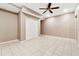 Neutral bedroom with a double door closet and tile flooring at 3055 Kennesaw Nw Dr, Kennesaw, GA 30152