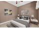 Staged bedroom featuring neutral paint, ceiling fan, and ample natural light from the window at 3055 Kennesaw Nw Dr, Kennesaw, GA 30152