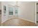 Bright breakfast nook with hardwood floors and a modern light fixture at 3055 Kennesaw Nw Dr, Kennesaw, GA 30152
