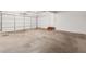 Spacious garage with a roll up door, perfect for parking and storage at 3055 Kennesaw Nw Dr, Kennesaw, GA 30152