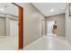 Spacious hallway with tile flooring, neutral walls, and recessed lighting at 3055 Kennesaw Nw Dr, Kennesaw, GA 30152