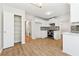 Well-lit kitchen with white cabinets, stainless steel appliances, and tile backsplash at 3055 Kennesaw Nw Dr, Kennesaw, GA 30152