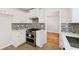 Modern kitchen featuring stainless steel appliances and white marble countertops at 3055 Kennesaw Nw Dr, Kennesaw, GA 30152