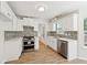 Modern kitchen featuring stainless steel appliances and white marble countertops at 3055 Kennesaw Nw Dr, Kennesaw, GA 30152