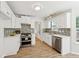 Modern kitchen featuring stainless steel appliances and white marble countertops at 3055 Kennesaw Nw Dr, Kennesaw, GA 30152