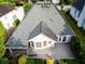 Aerial view of backyard showing deck, patio and landscaped lawn at 3082 Monarch Pine Dr, Peachtree Corners, GA 30071