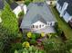 Aerial view of backyard showing deck, patio and landscaped lawn at 3082 Monarch Pine Dr, Peachtree Corners, GA 30071