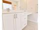 Modern bathroom with double vanity, quartz countertop, and tile flooring at 3082 Monarch Pine Dr, Peachtree Corners, GA 30071